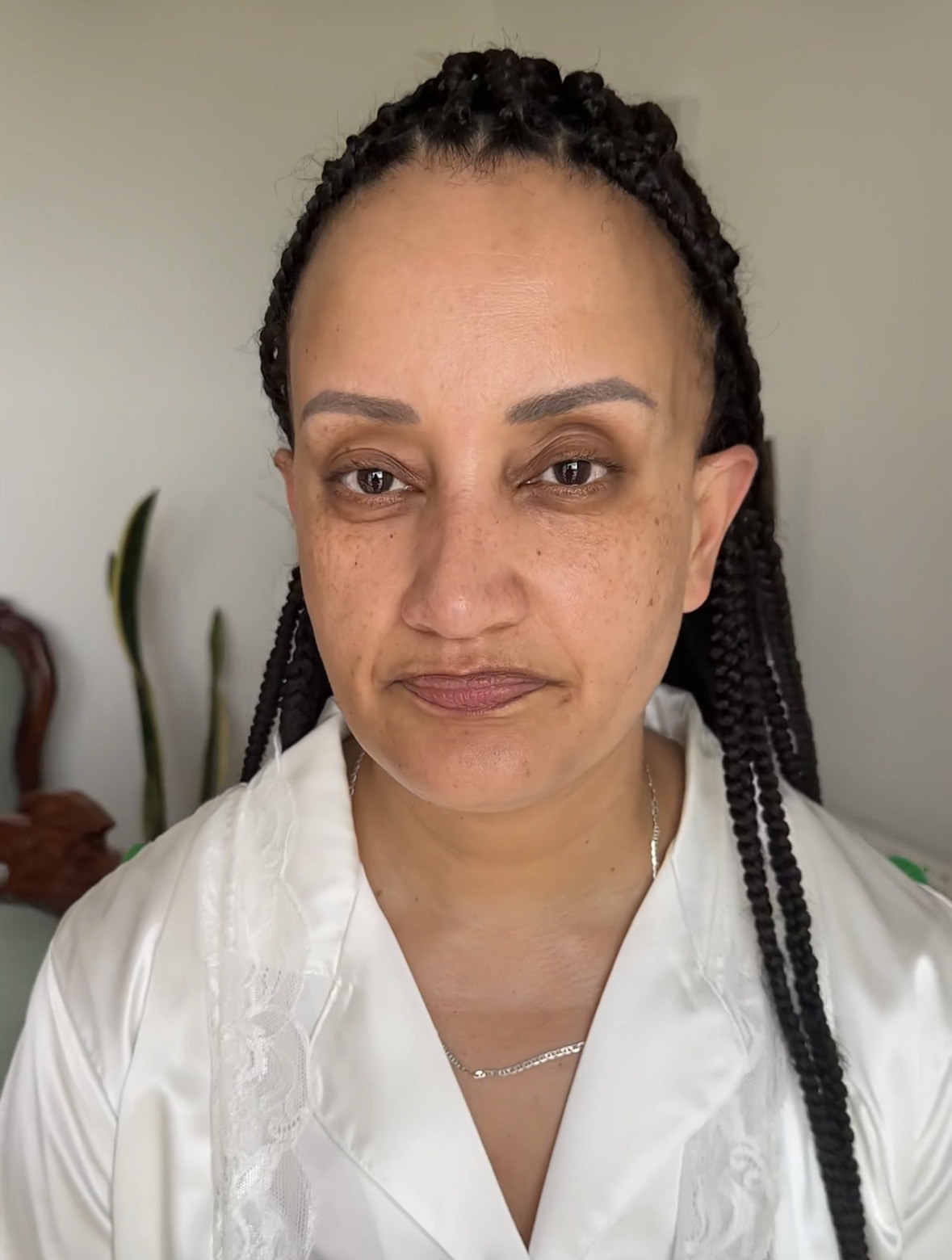 Lezette before her bridal makeup, natural skin and braided hair