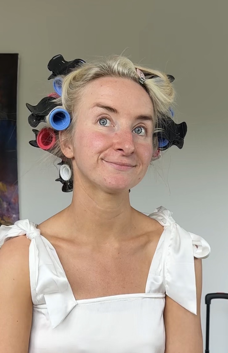 Abbi before her bridal makeup, natural skin and hair set in rollers on the wedding morning