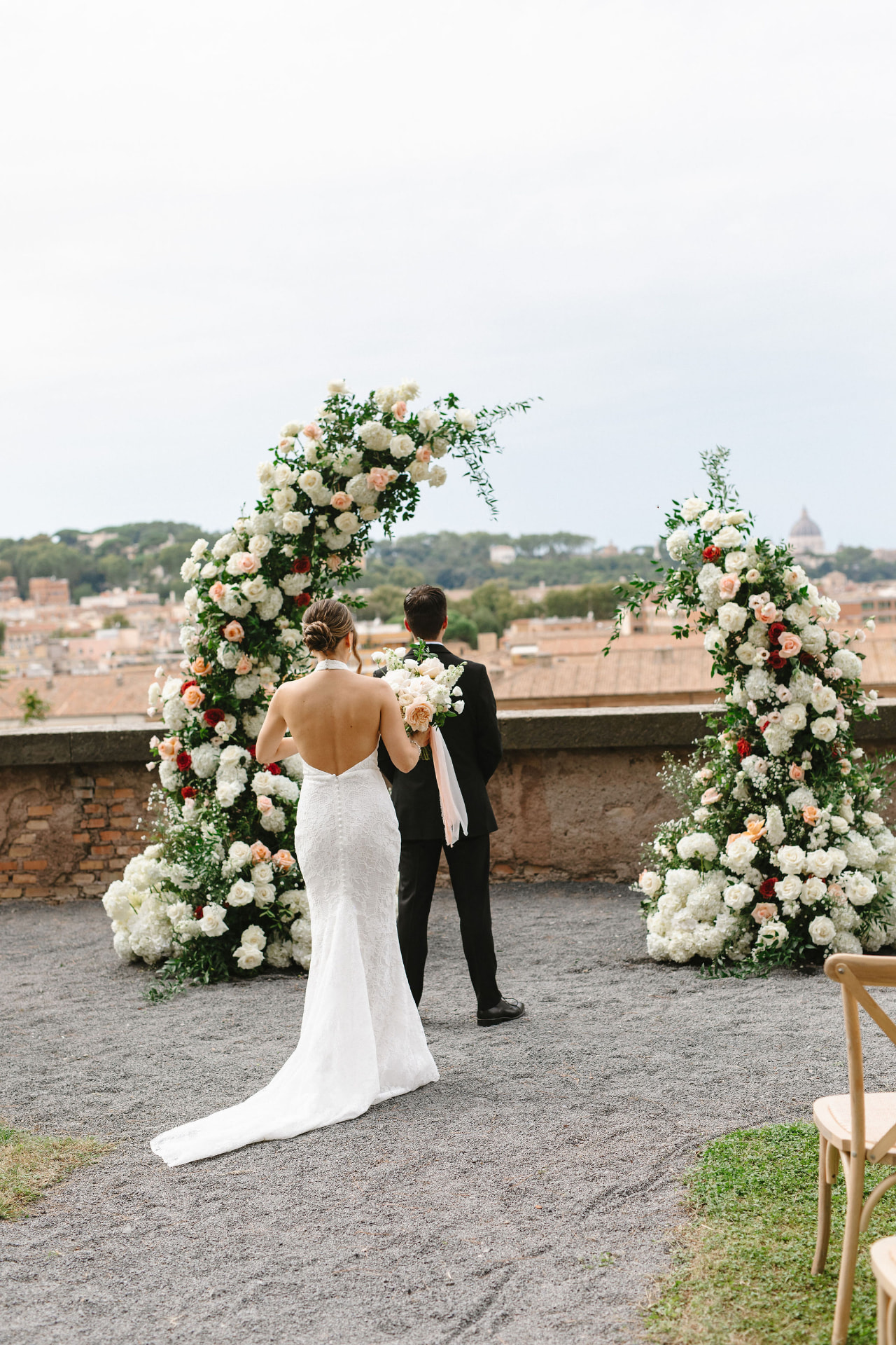 Real bride at a rooftop ceremony in Rome wearing a sleek low chignon