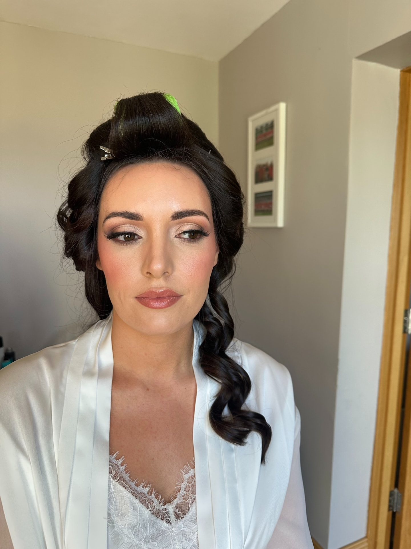 Bride getting ready on the wedding morning with finished soft glam makeup